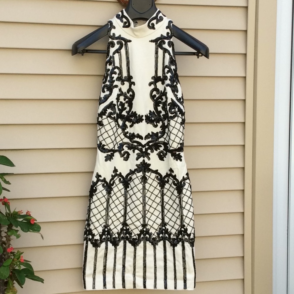 Bebe swirl beaded mock neck dress.